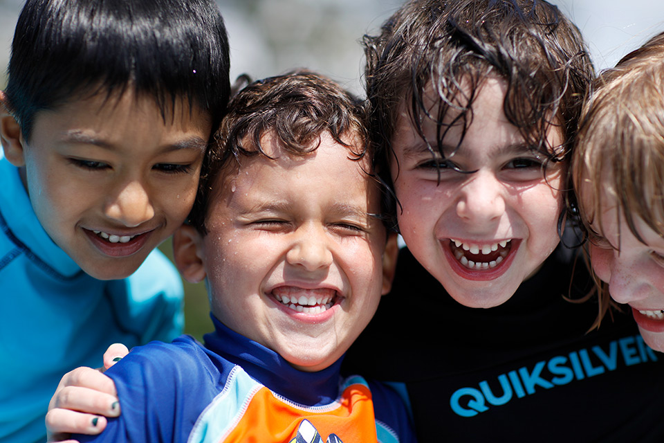 Children smiling during water play
